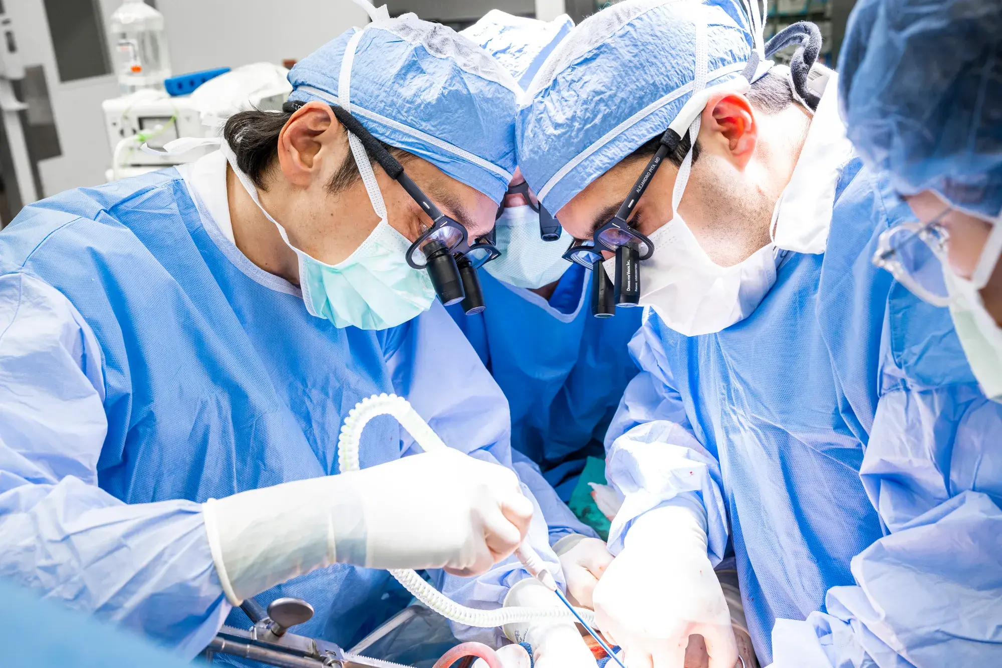 A surgical team in an operating room preparing for a liver transplant procedure